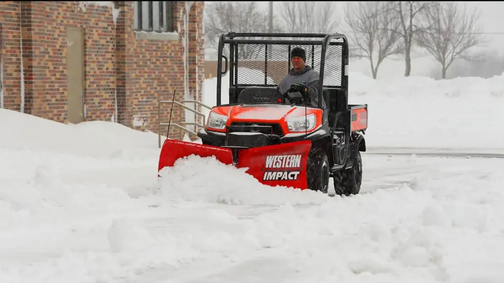 Western Impact Utv V-Plow pushing snow