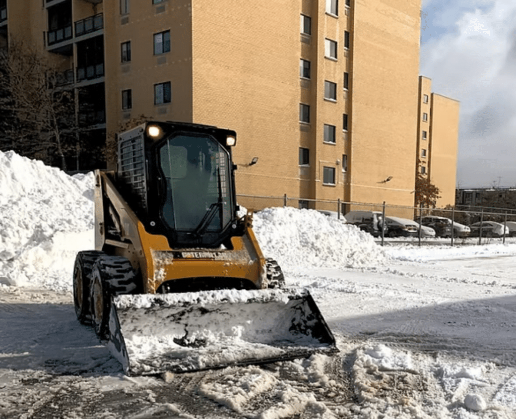 CAT skidsteer snow removal in NYC